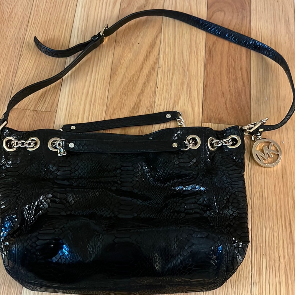Micheal Kohrs cross body